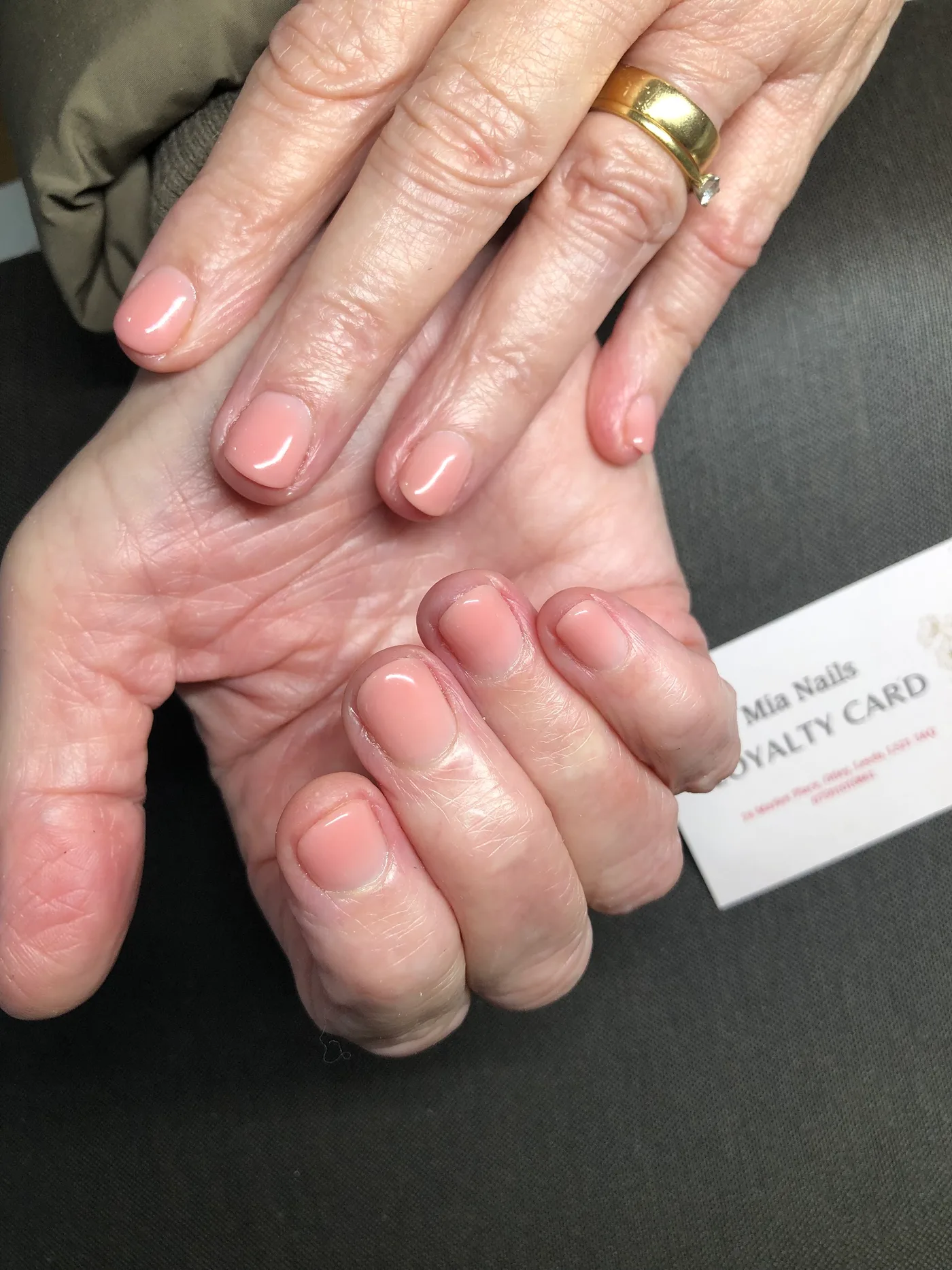 Short soft pink nails with a glossy finish